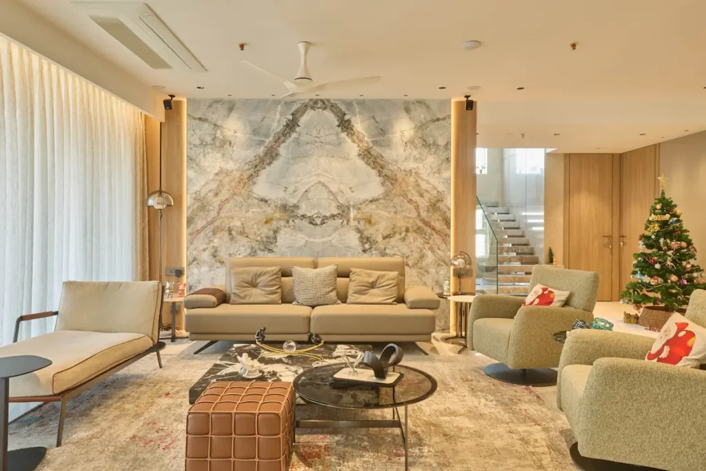 Luxury Living Room with Marble Wall, Neutral Tones and Modern Furniture